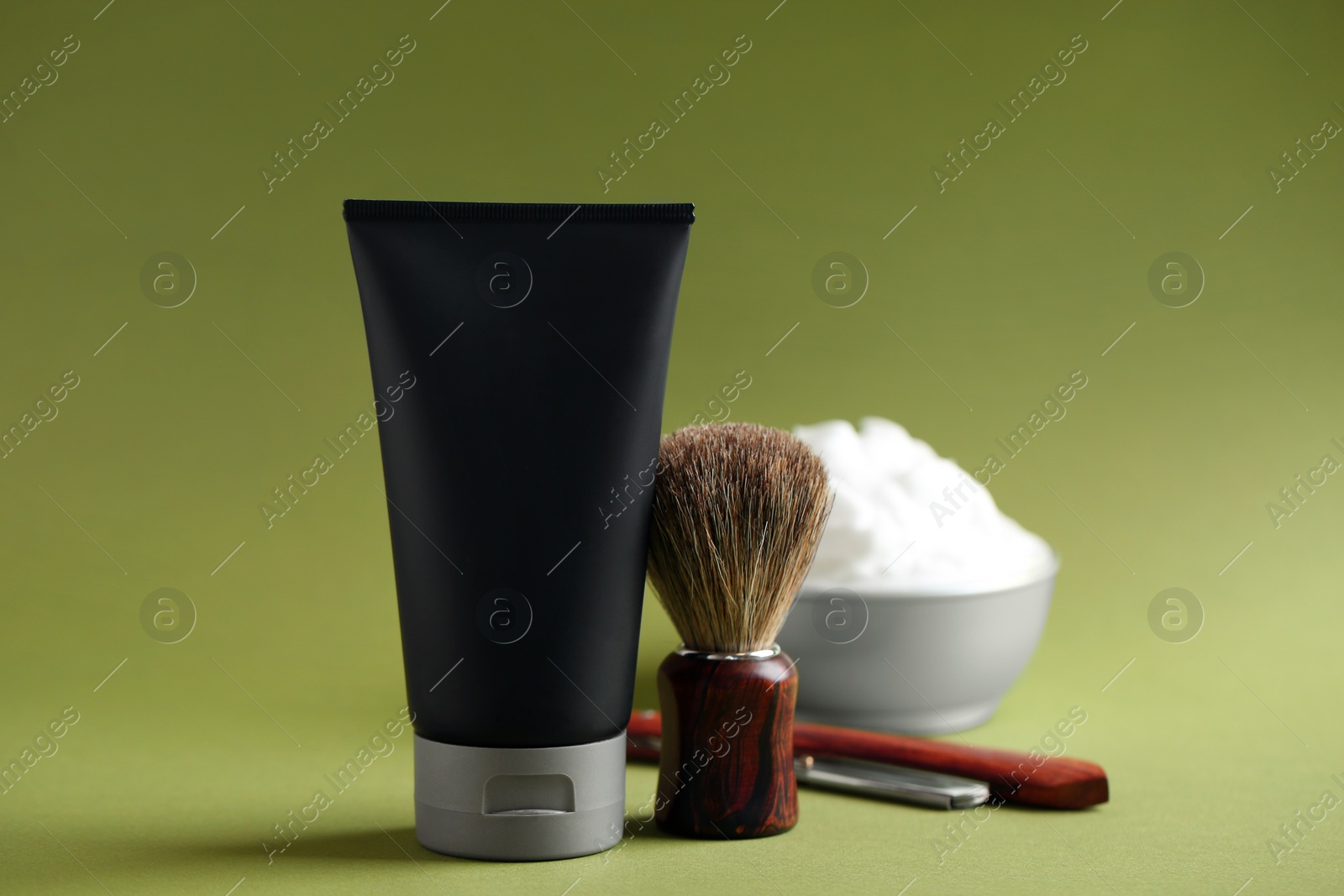 Photo of Set of shaving equipment and men's cosmetic products on color background