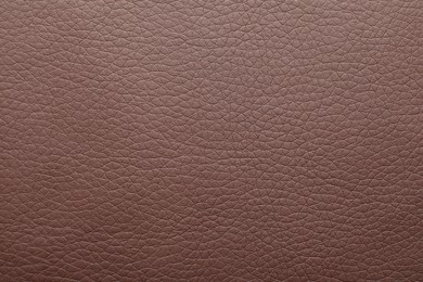 Photo of Texture of brown leather as background, closeup