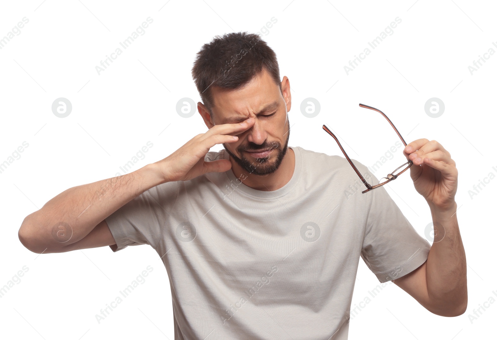 Photo of Man suffering from eyestrain on white background