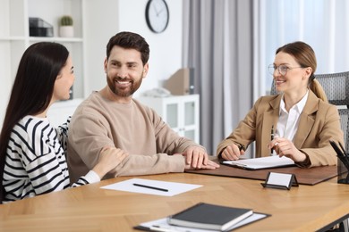 Couple having meeting with lawyer in office