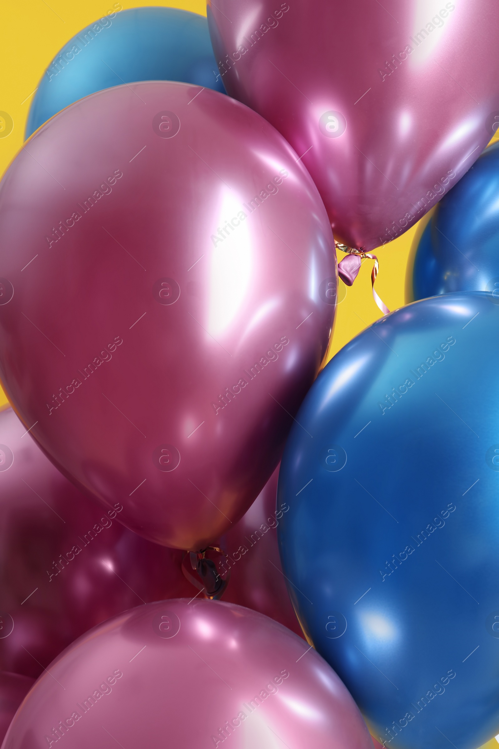 Photo of Bunch of bright balloons, closeup view. Party objects