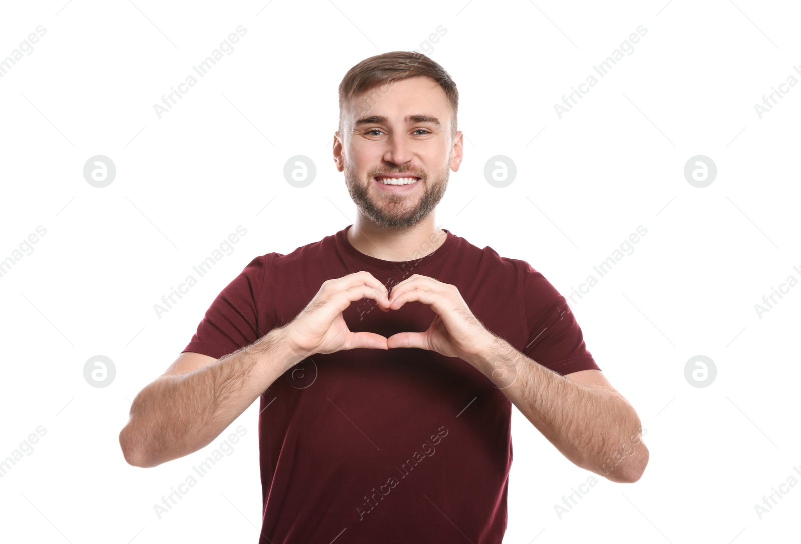 Photo of Man showing HEART gesture in sign language on white background