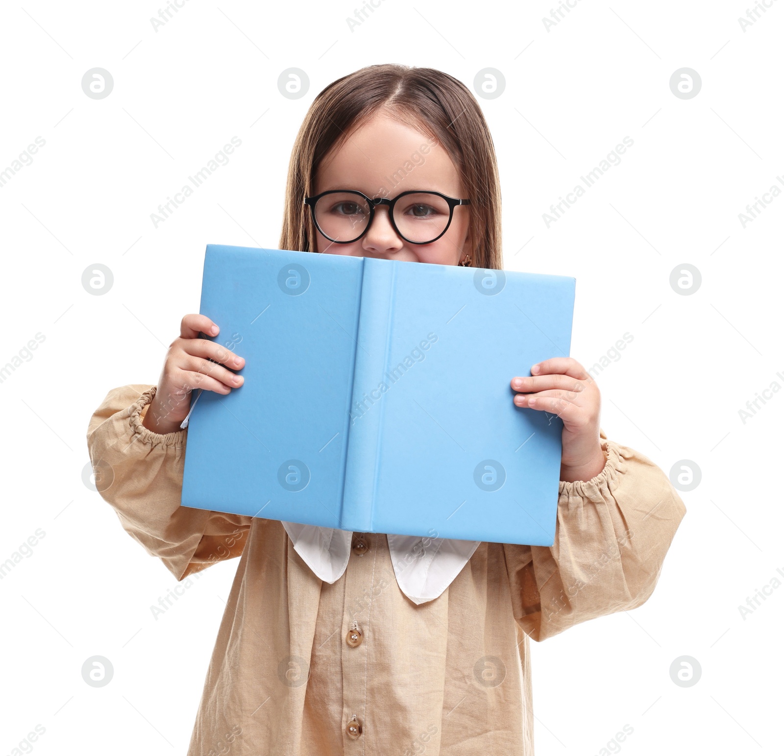 Photo of Cute little girl in glasses with open book on white background