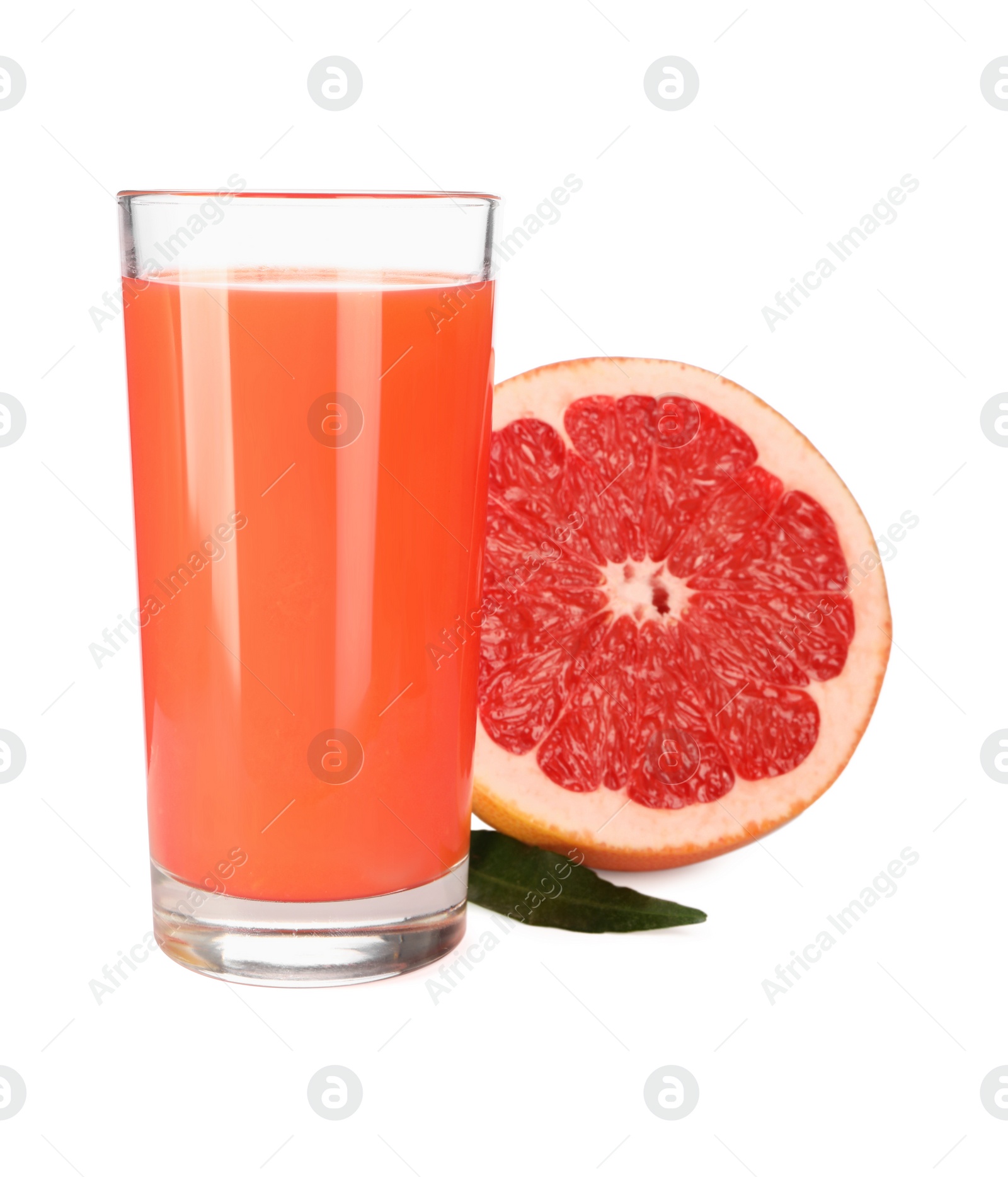 Photo of Tasty grapefruit juice in glass, fresh fruit and green leaf isolated on white