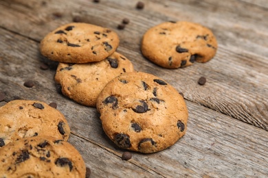 Delicious chocolate chip cookies on wooden table