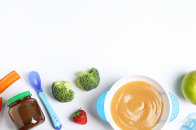 Photo of Flat lay composition with healthy baby food and ingredients on white background. Space for text