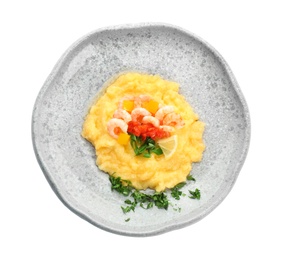 Plate with tasty shrimps and grits on white background, top view