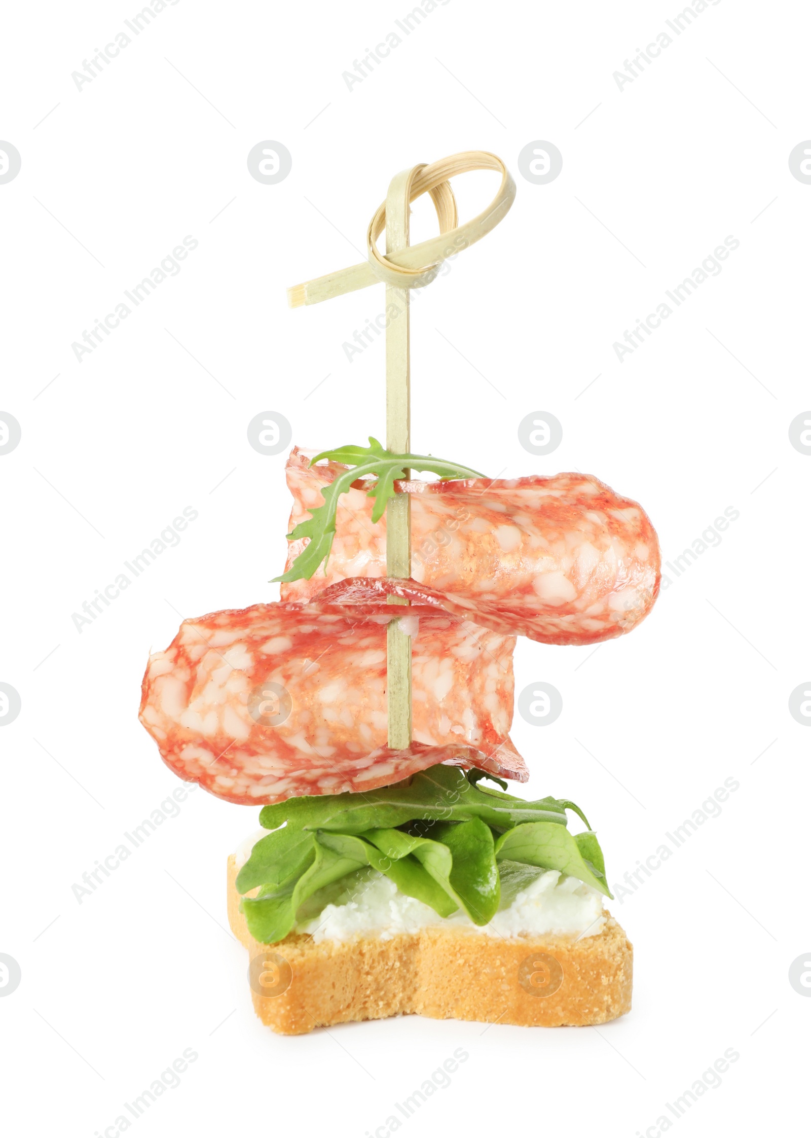 Photo of Tasty canape with salami, greens and cream cheese isolated on white