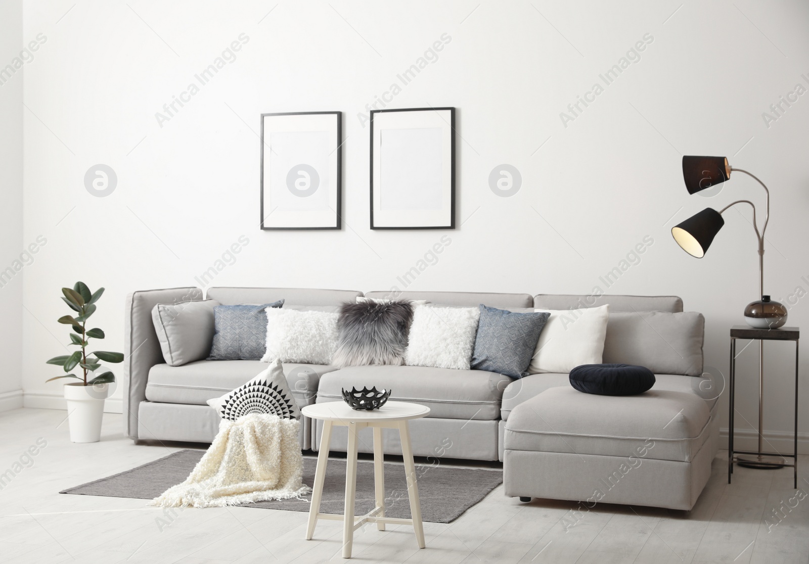 Photo of Stylish living room interior with comfortable sofa