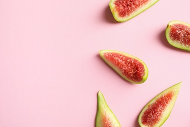 Fresh ripe fig slices on color background, top view. Space for text