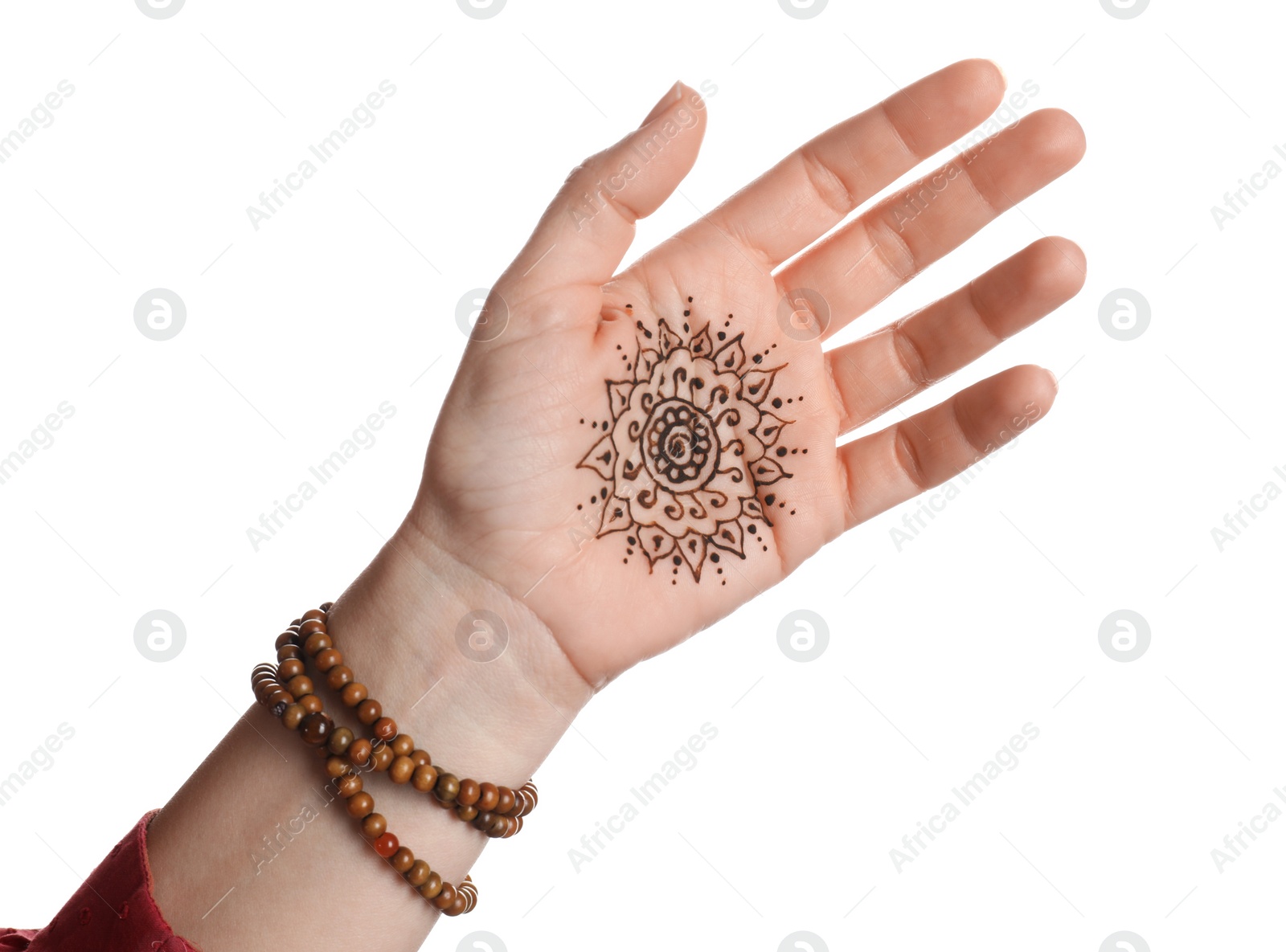 Photo of Woman with beautiful henna tattoo on hand against white background, closeup. Traditional mehndi