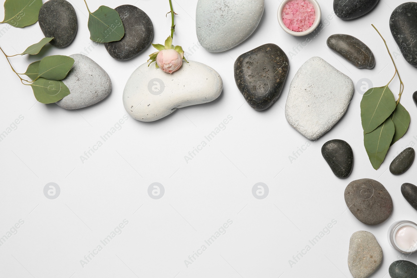 Photo of Flat lay composition with spa stones and space for text on white background