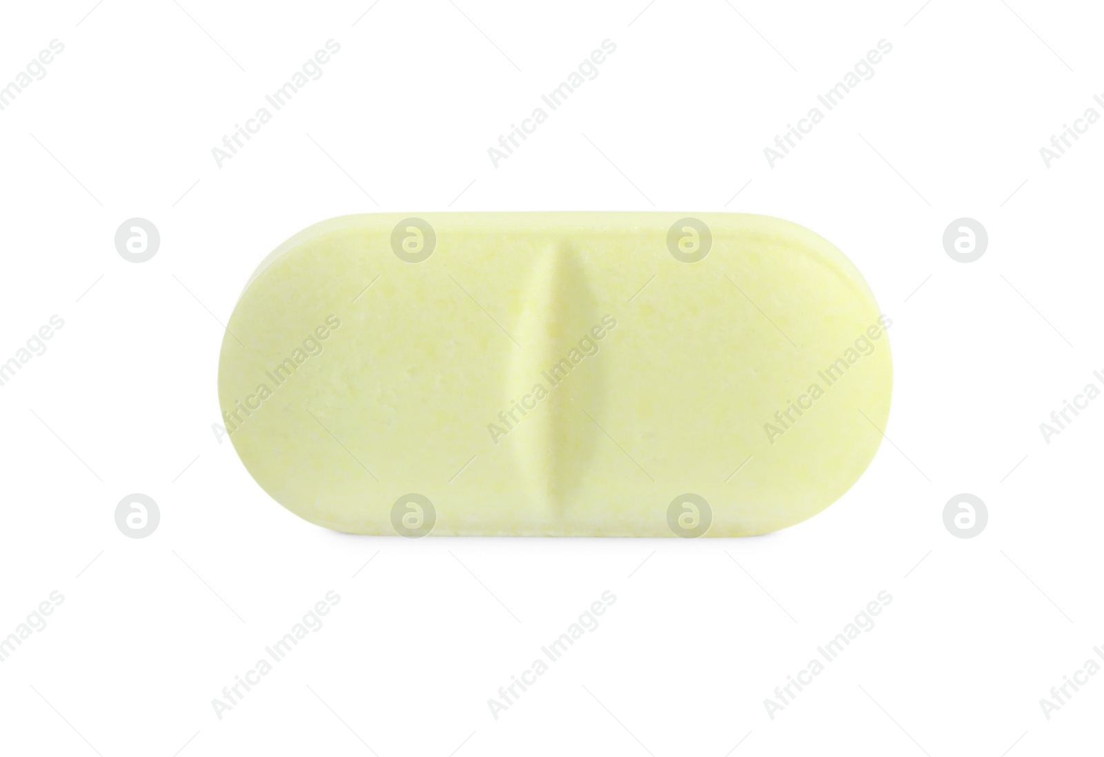 Photo of One yellow pill isolated on white. Medicinal treatment