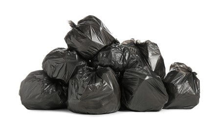 Photo of Black trash bags filled with garbage on white background
