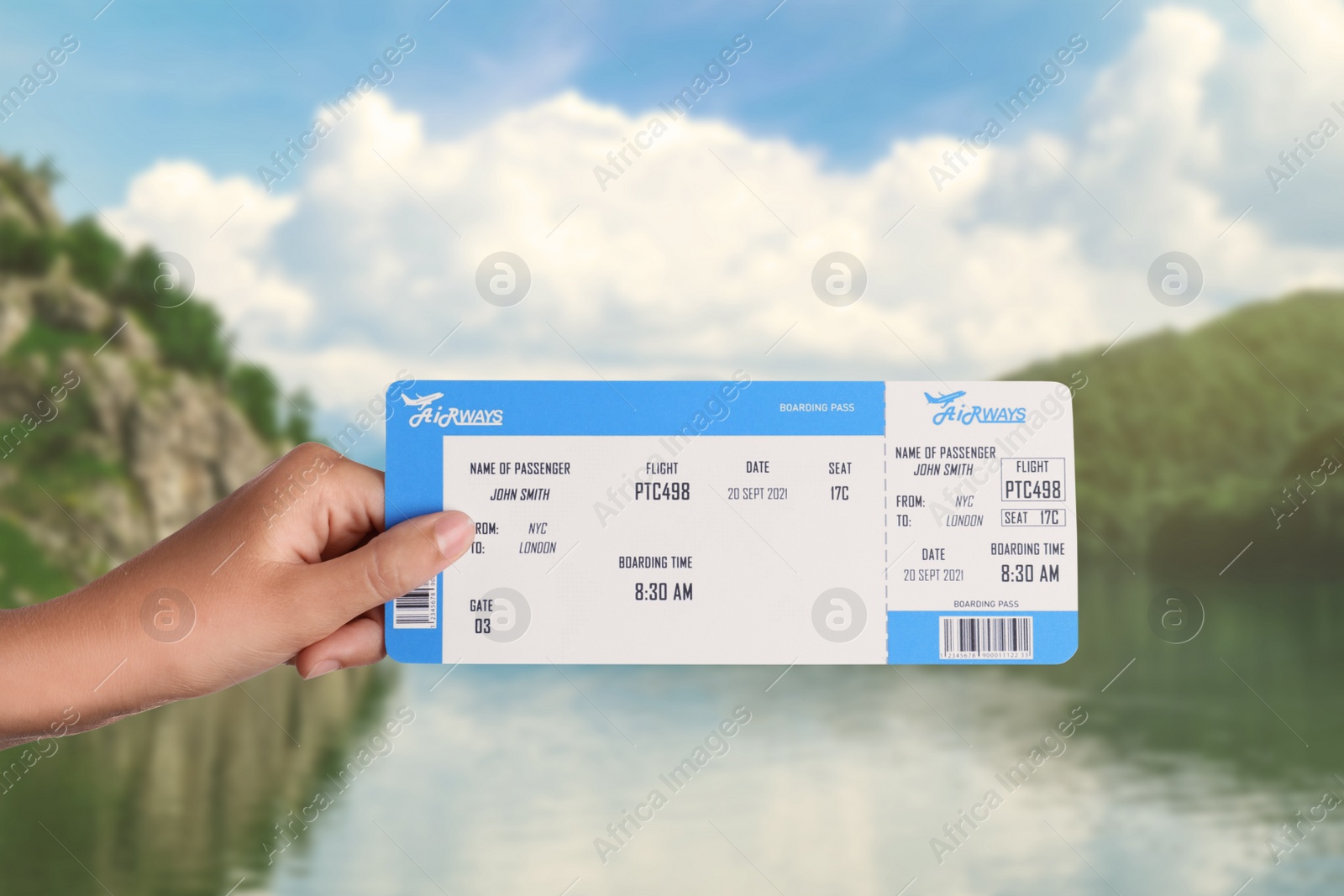 Image of Woman holding ticket near lake and mountains, closeup. Travel agency service