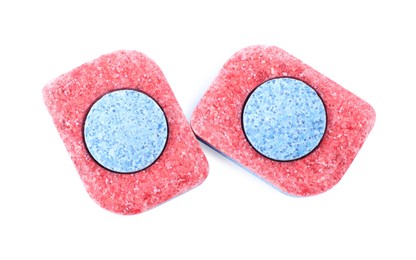 Photo of Two dishwasher detergent tablets on white background, top view