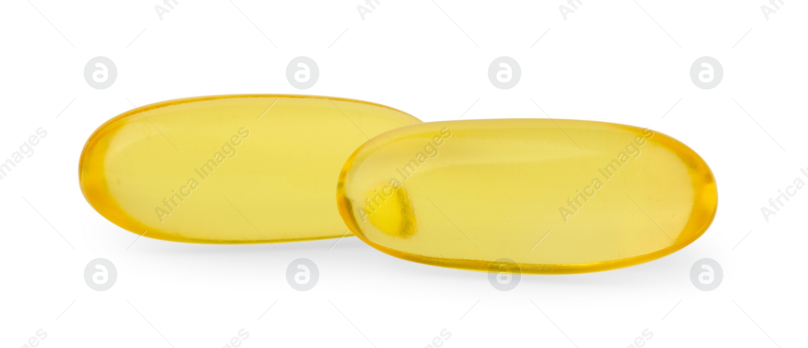 Photo of Yellow vitamin capsules isolated on white. Health supplements