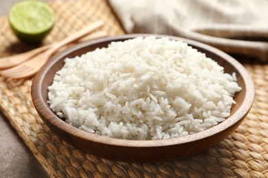 Photo of Plate of tasty cooked rice served on table, closeup