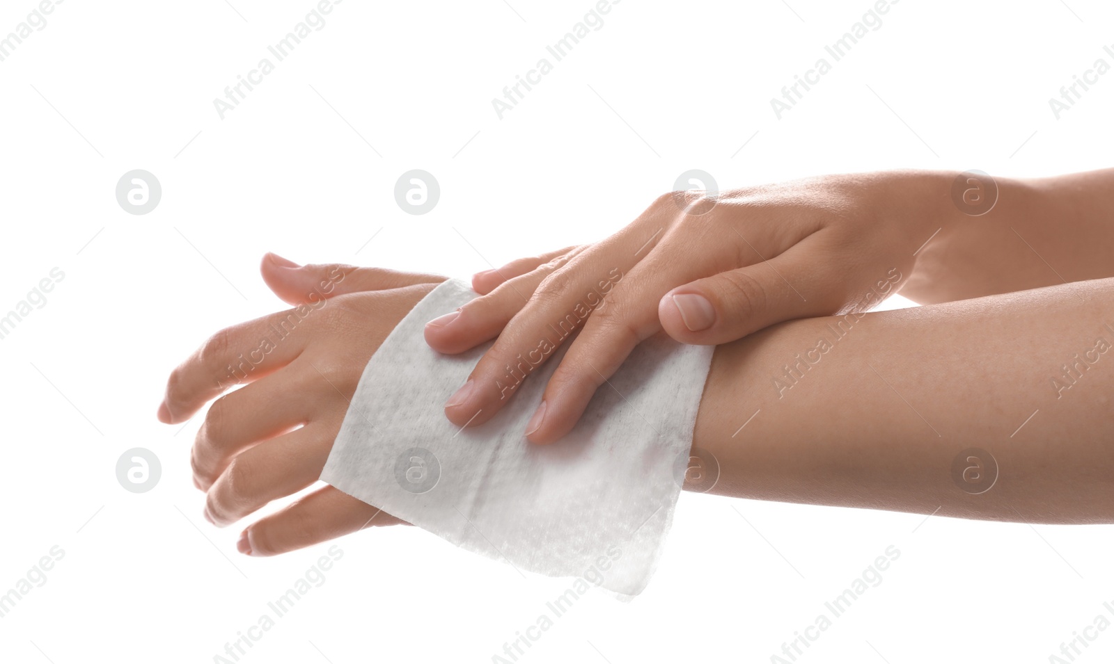 Photo of Woman cleaning wrist with wet wipe on white background, closeup