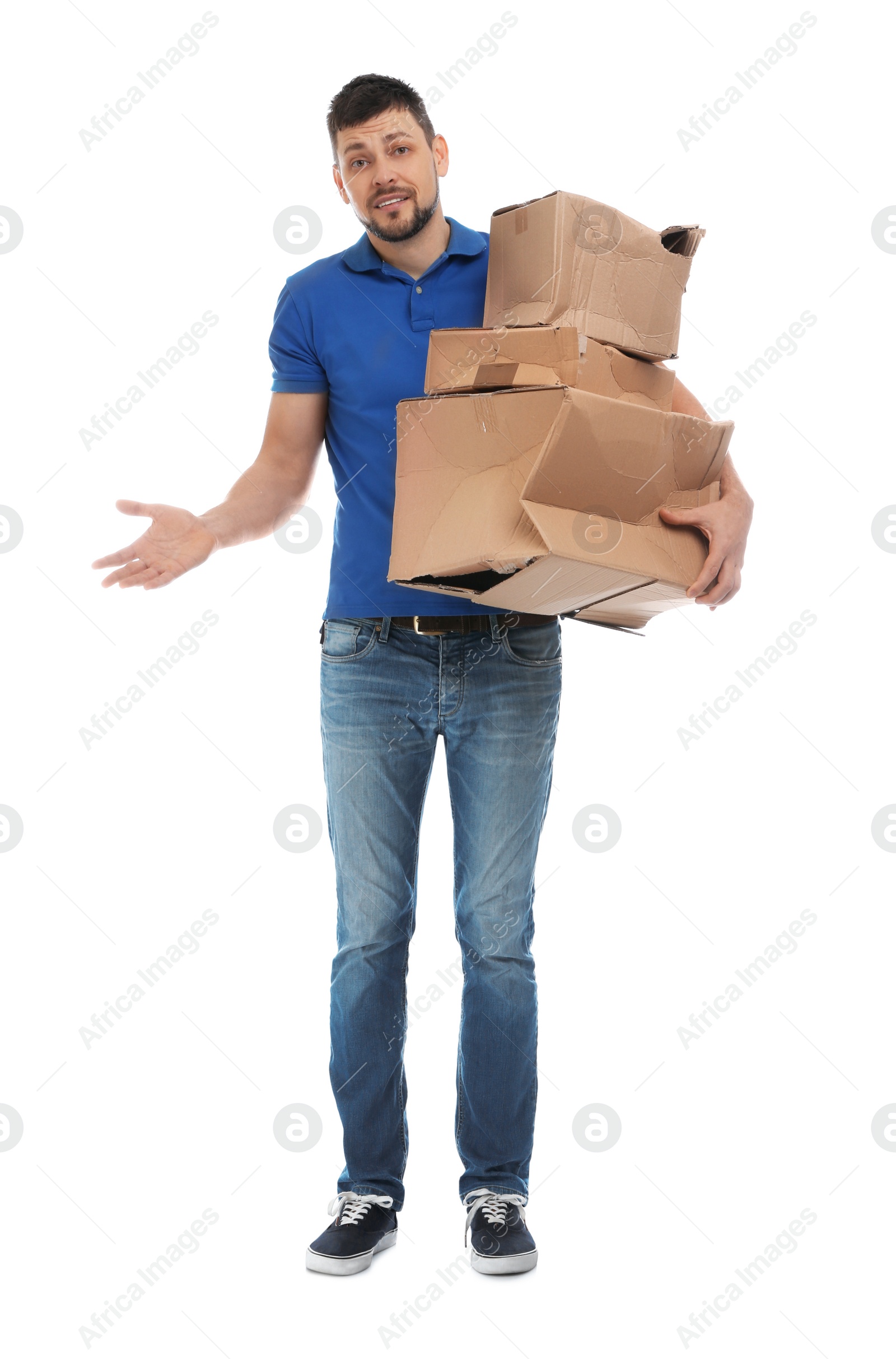 Photo of Emotional courier with damaged cardboard boxes on white background. Poor quality delivery service