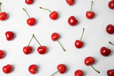 Photo of Sweet red cherries on white background