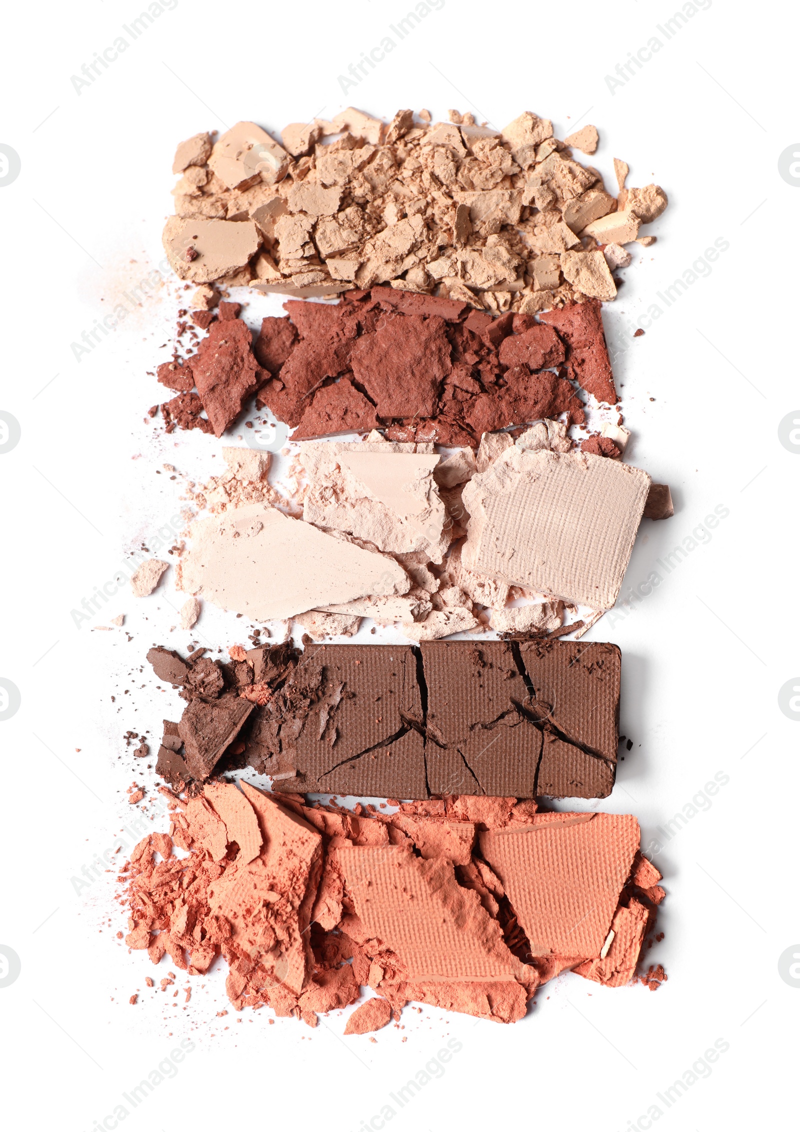 Photo of Crushed eye shadows on white background, top view. Professional makeup product