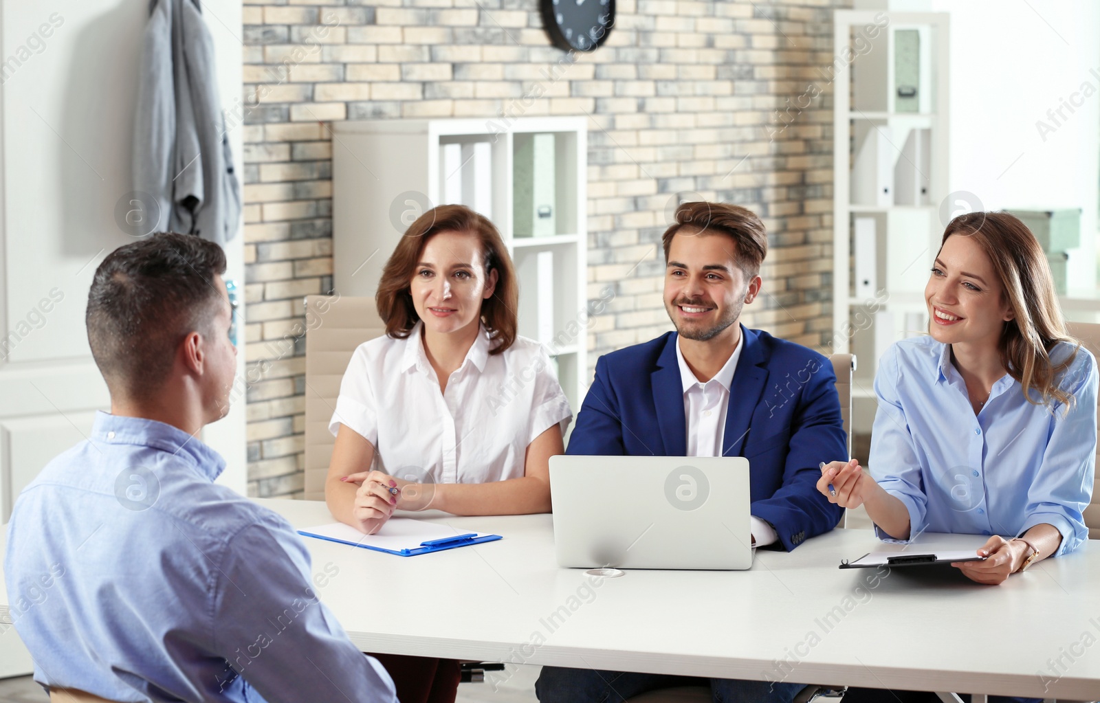 Photo of Human resources commission conducting job interview with applicant in office