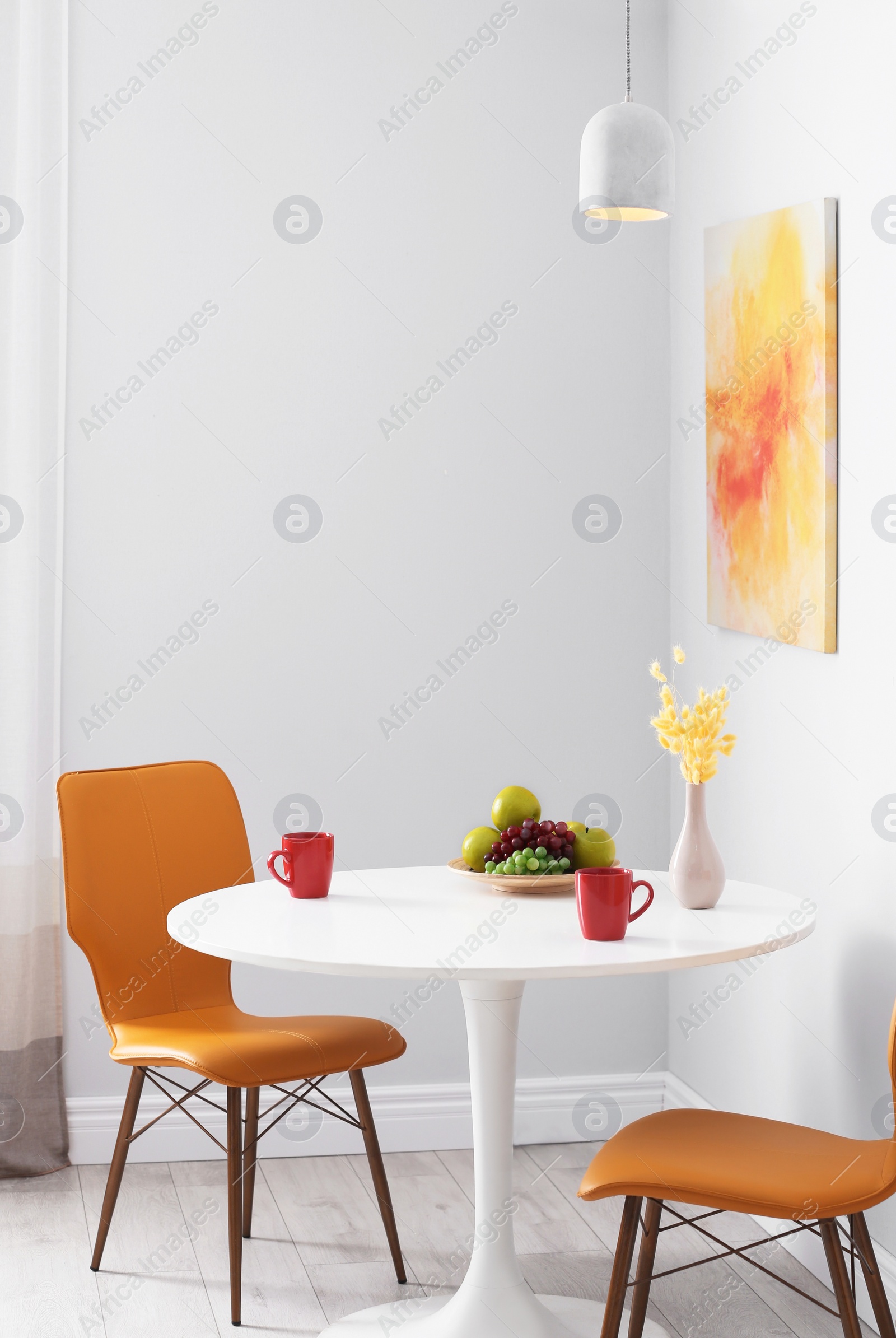 Photo of Stylish dining room interior. Home design idea