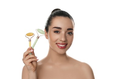 Woman with natural face jade rollers on white background