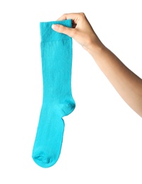 Photo of Woman holding colorful sock on white background