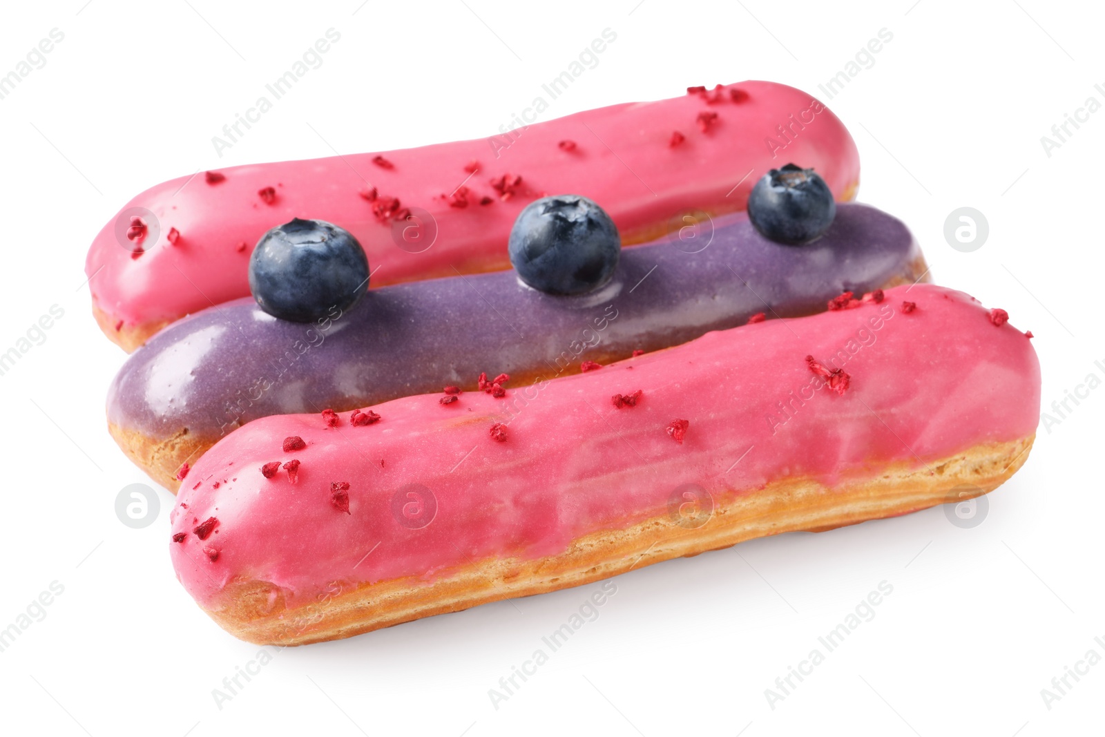 Photo of Delicious eclairs covered with glaze isolated on white