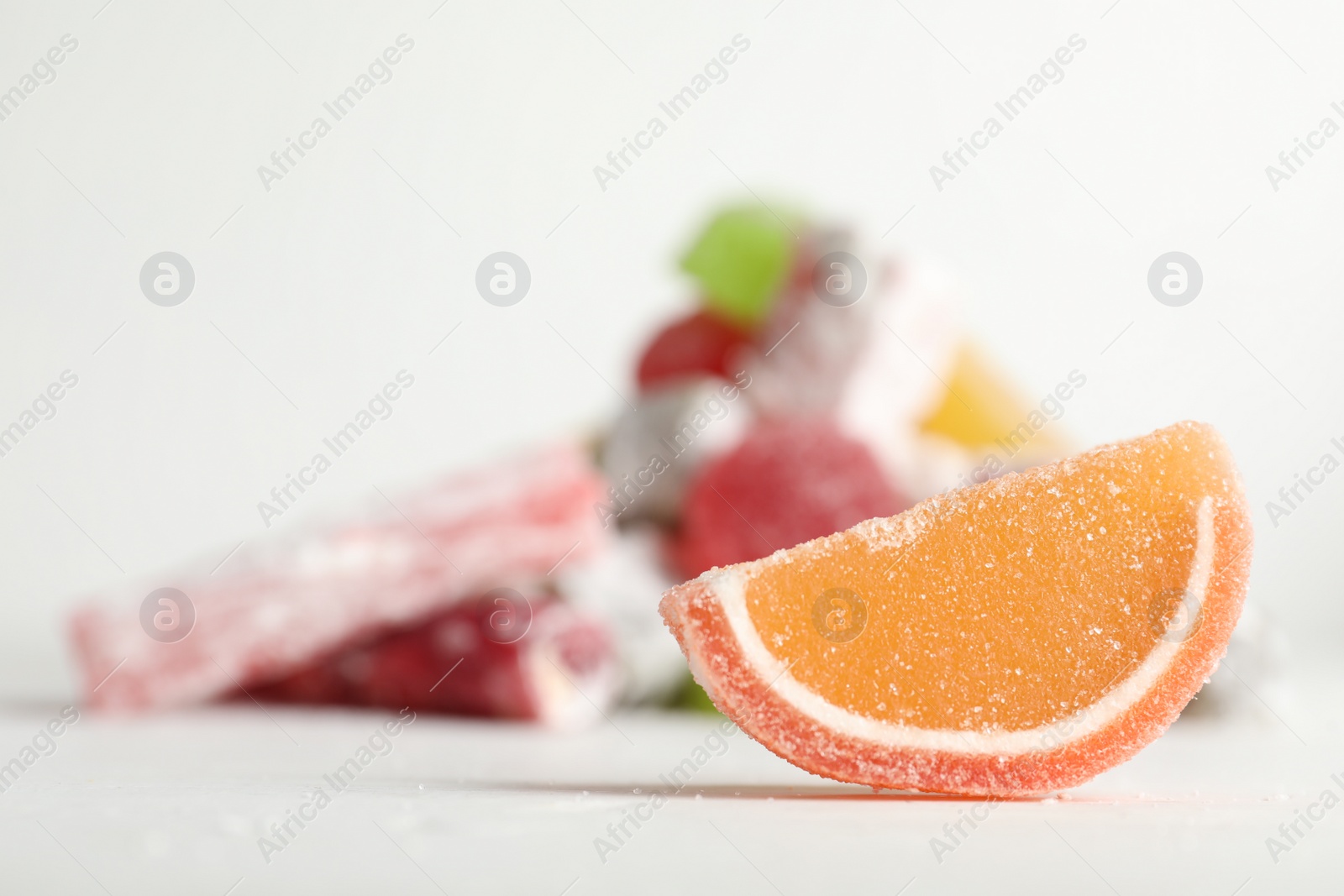 Photo of Sweet jelly slice on white table. Space for text