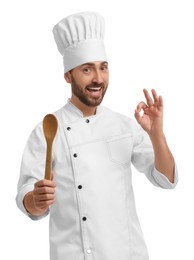Photo of Mature chef with spoon showing ok gesture on white background