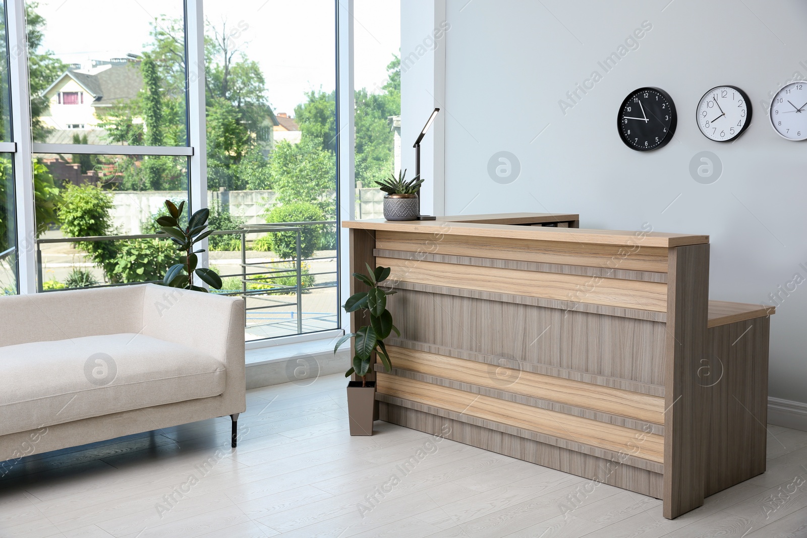Photo of Lobby interior with stylish wooden receptionist desk