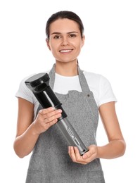 Photo of Beautiful young woman holding sous vide cooker on white background