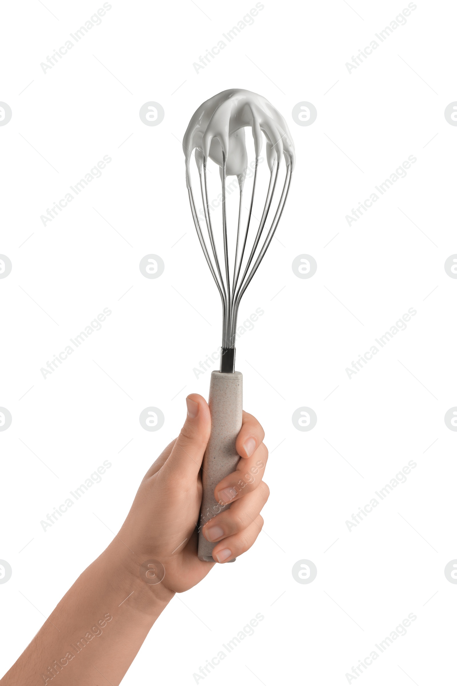 Photo of Woman holding whisk with whipped cream on white background, closeup