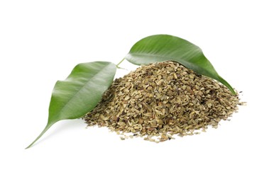 Photo of Pile of aromatic mate tea and fresh leaves on white background