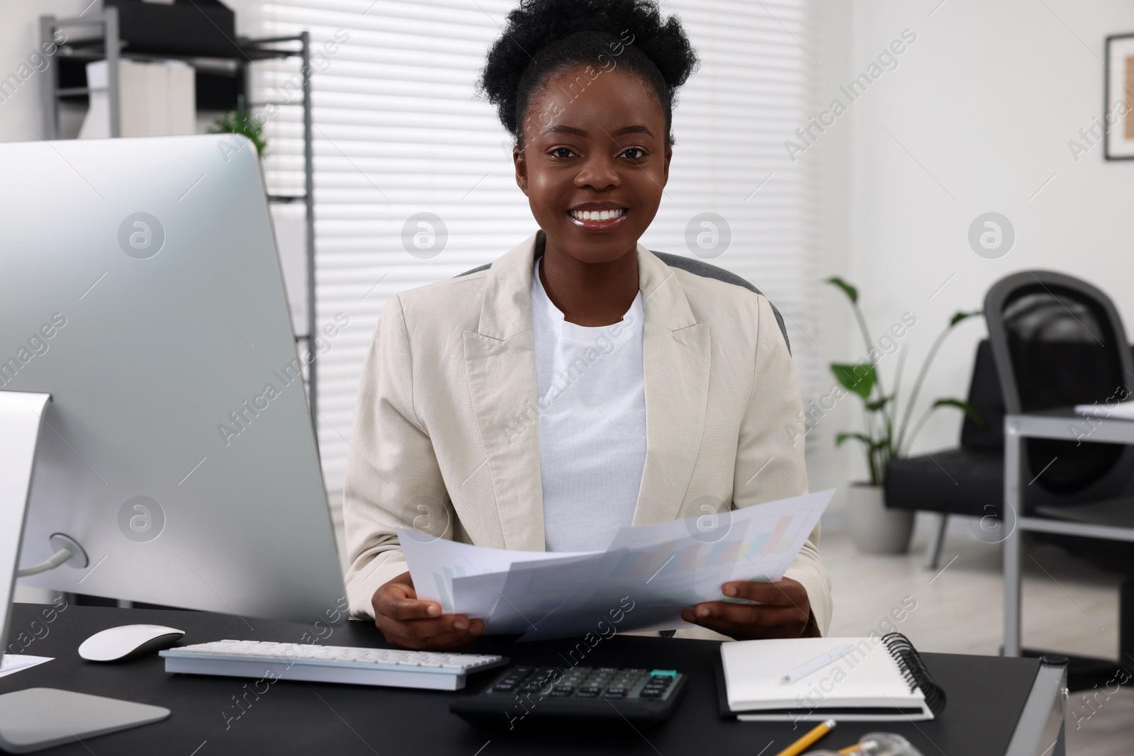 Photo of Professional accountant working at desk in office