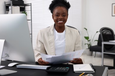 Professional accountant working at desk in office