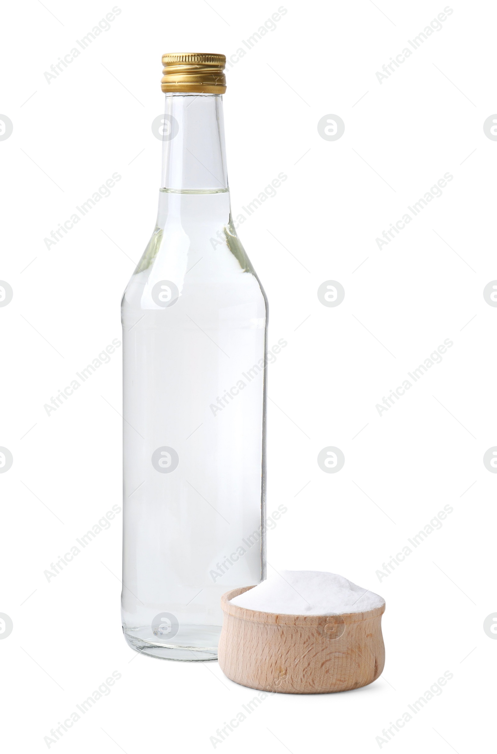 Photo of Vinegar in glass bottle and baking soda isolated on white