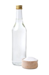 Vinegar in glass bottle and baking soda isolated on white