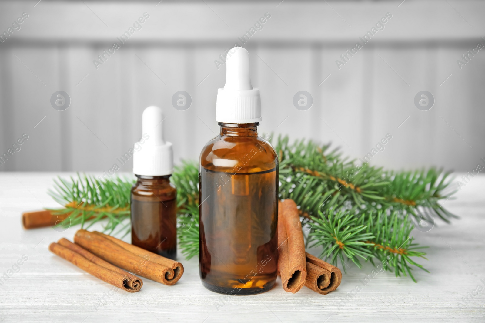 Photo of Composition with essential oils and ingredients on table