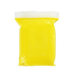 Photo of Package of yellow play dough on white background, top view