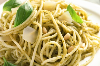 Delicious basil pesto pasta on plate, closeup