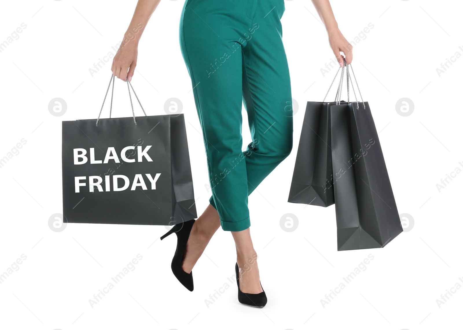Photo of Woman with shopping bags on white background, closeup. Black Friday Sale