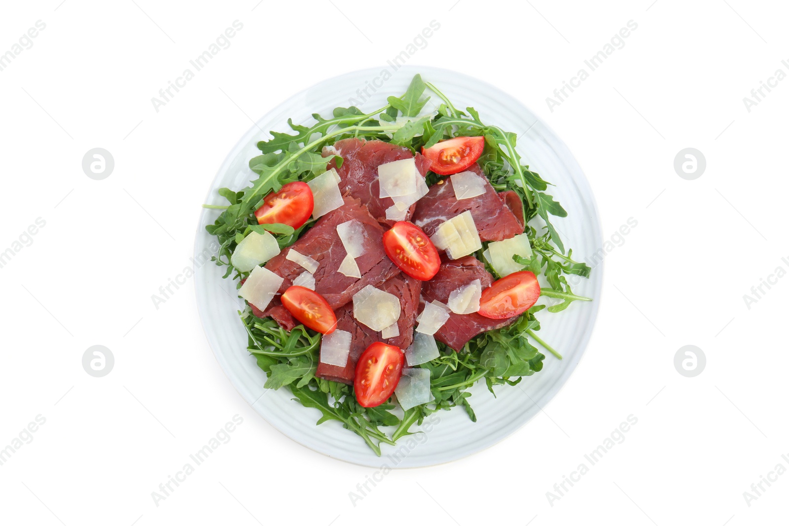 Photo of Delicious bresaola salad with parmesan cheese isolated on white, top view