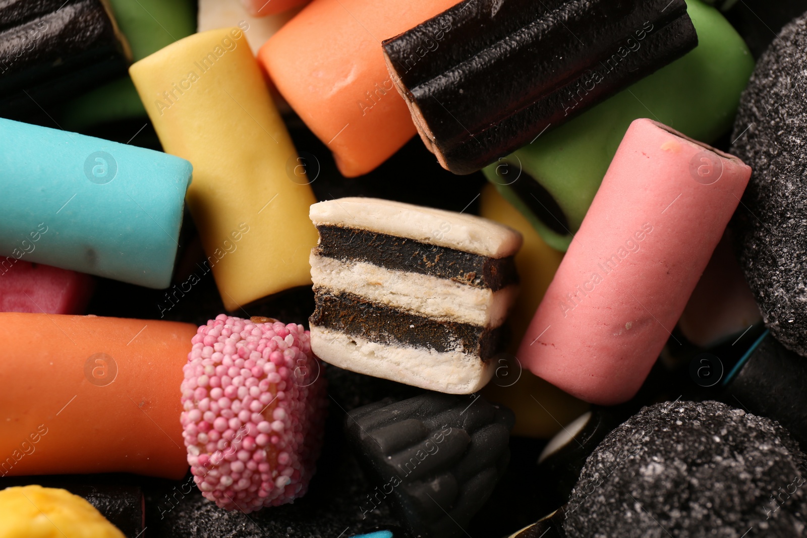 Photo of Many different liquorice candies as background, closeup