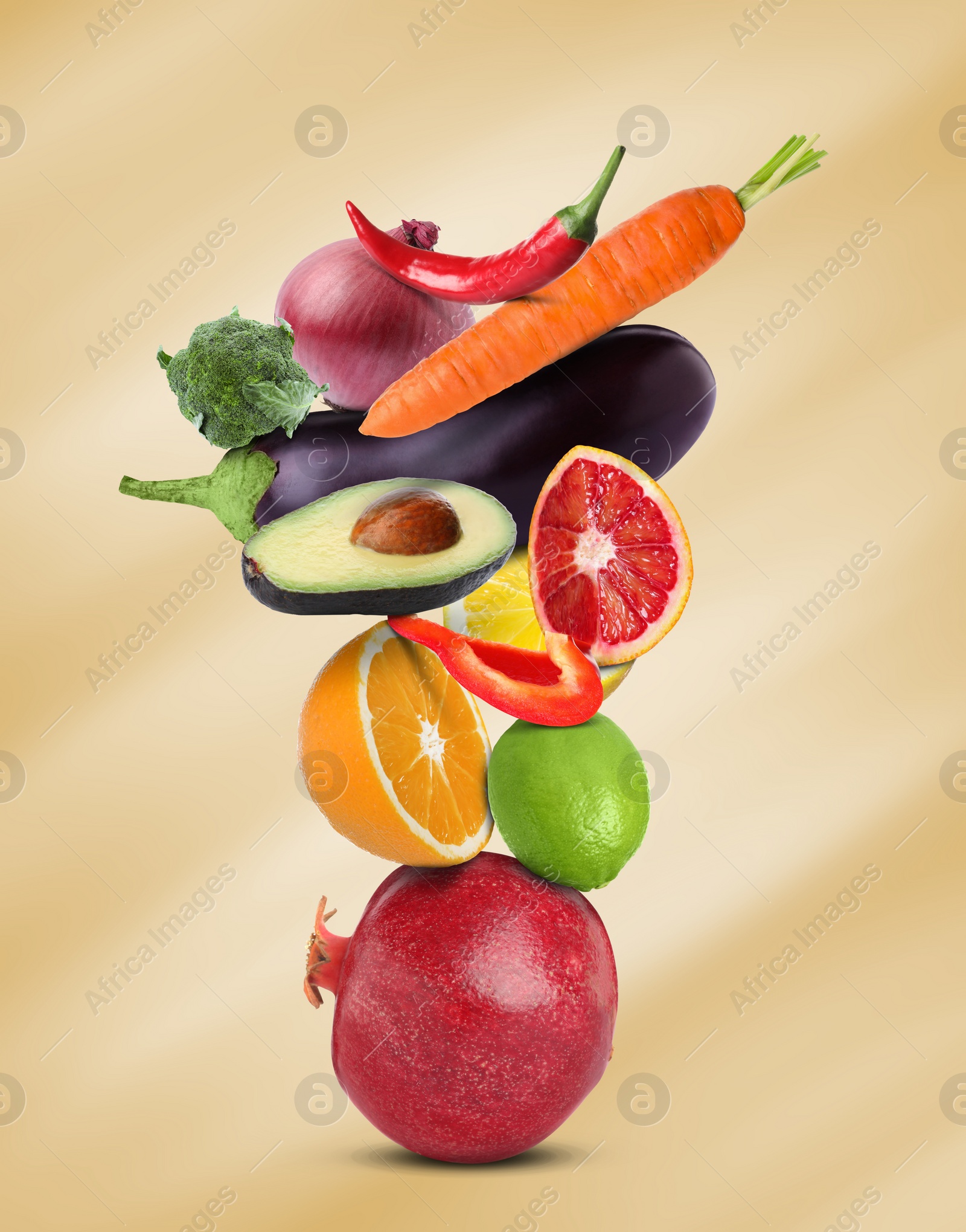 Image of Stack of different vegetables and fruits on pale gold background