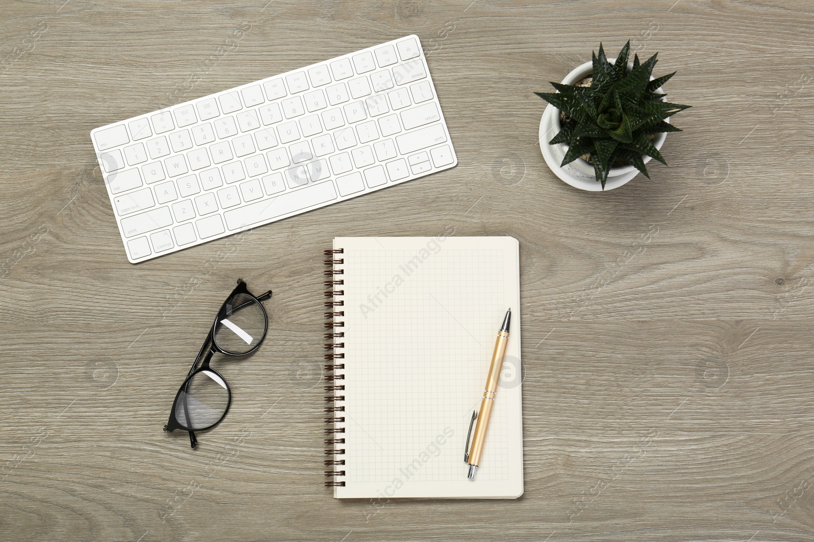 Photo of Flat lay composition with notebook on wooden table