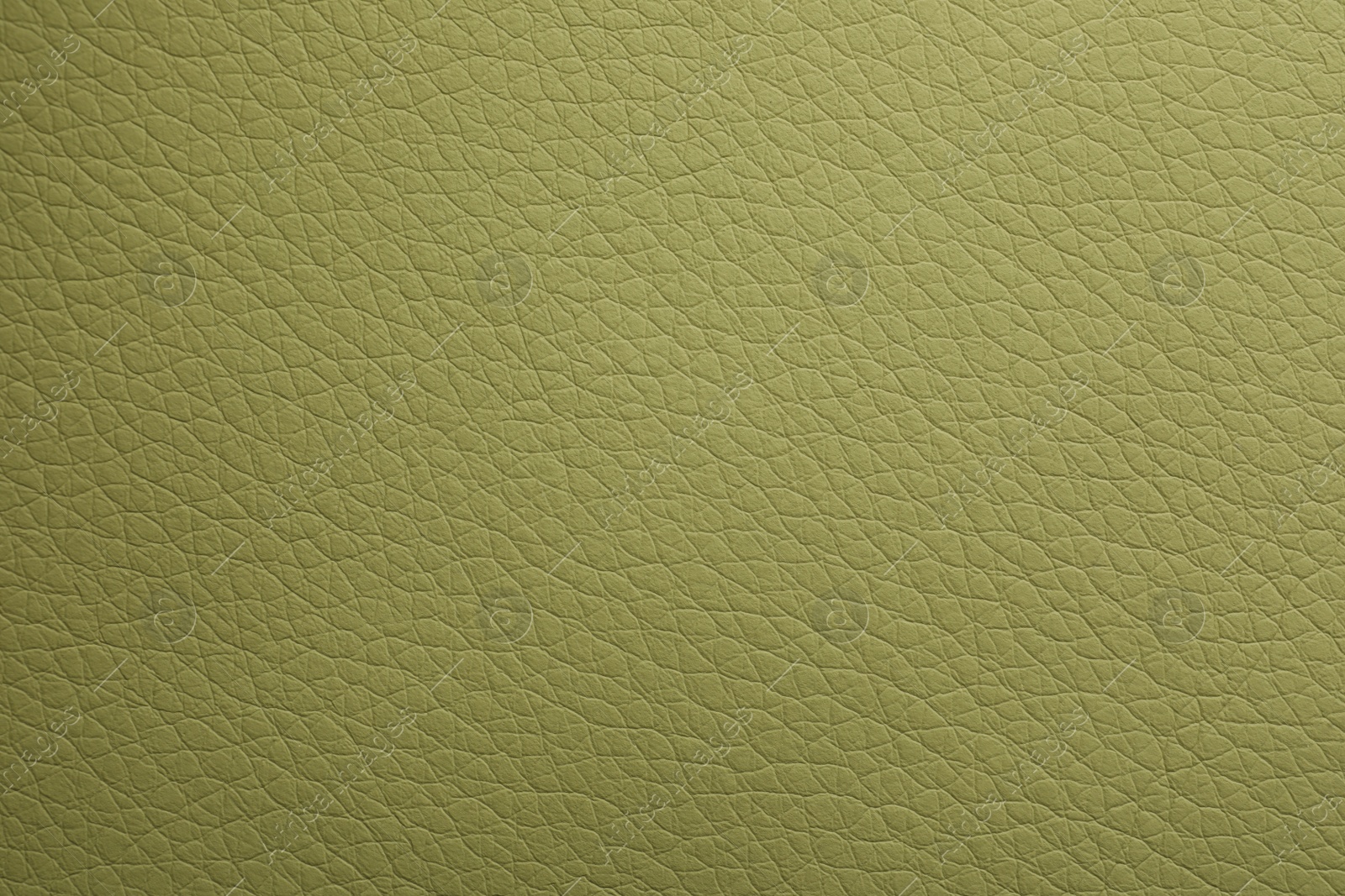 Photo of Texture of green leather as background, closeup